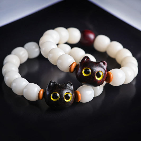 Pulsera de Buda con semillas de Bodhi naturales, hojas pequeñas, sándalo rojo, madera de ébano y gato de la suerte. 