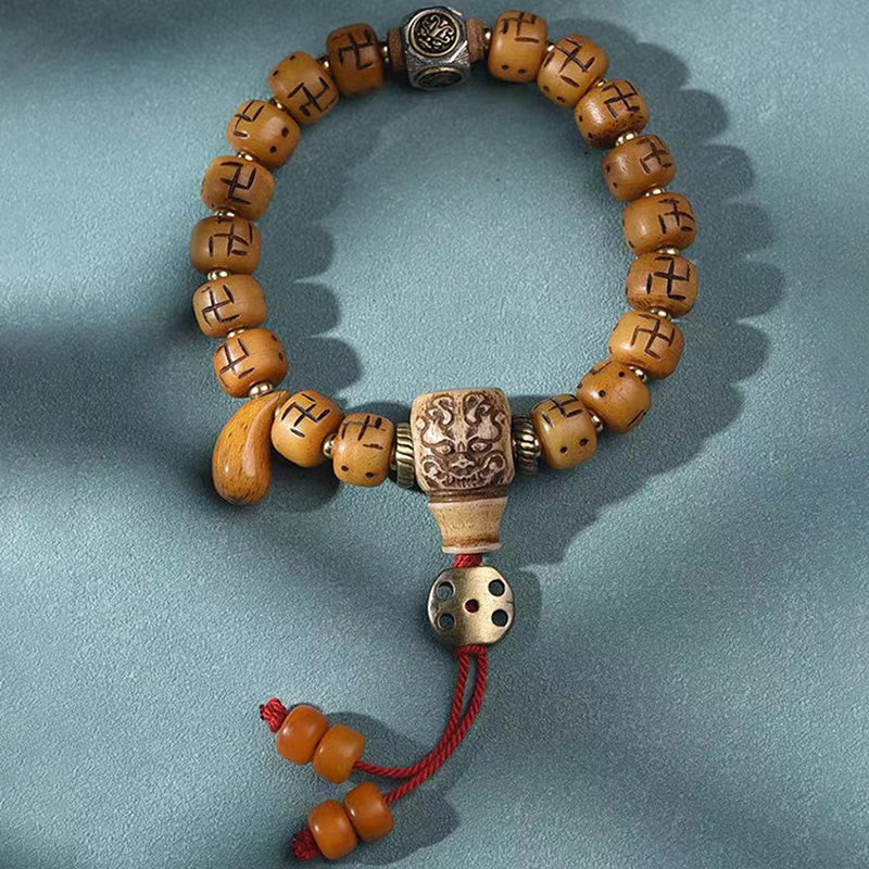Buddha-Steine, natürliches tibetisches Kamelknochen-Hakenkreuz-Dzi-Perlen-Shankha-Buddha-Charm, Kirtimukha-Glücksschutz-Quastenarmband
