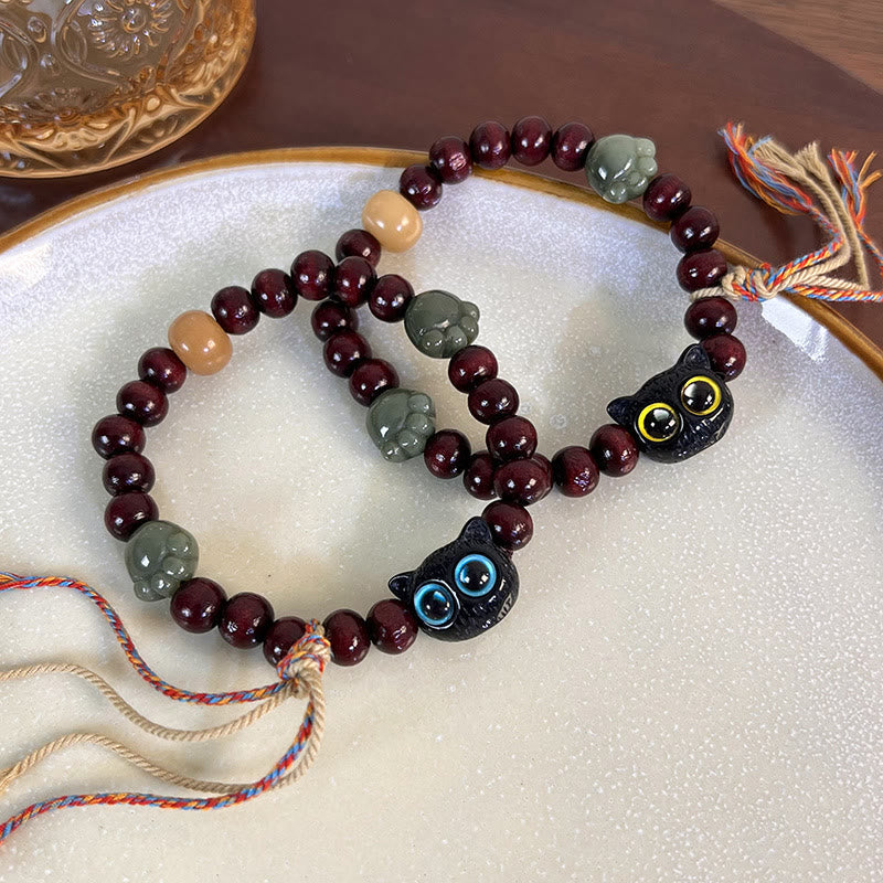 Pulsera de madera con borlas de la paz, con piedras de Buda, madera de ébano y pata de jade de gato encantador 