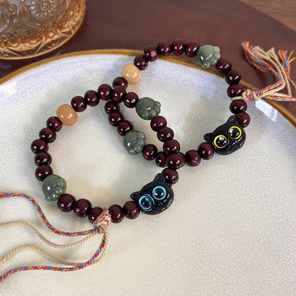 Pulsera de madera con borlas de la paz, con piedras de Buda, madera de ébano y pata de jade de gato encantador 
