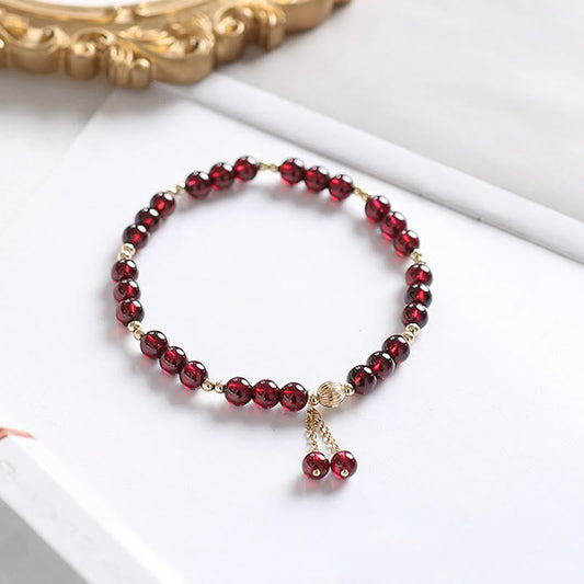 Pulsera de granate natural con piedras de Buda en oro de 14 quilates 