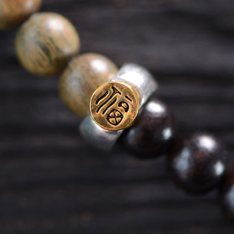 Pulsera de doble vuelta con cuentas Dzi de tres ojos de madera de ébano y sándalo verde tibetano con piedras de Buda y carácter Fu, equilibrio y paz.