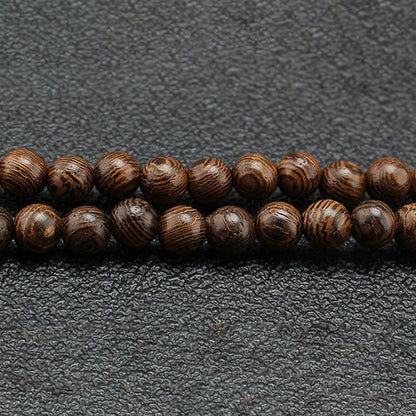 Collar con colgante de piedra turquesa, madera de wengué y piedras de Buda que protegen la calma.