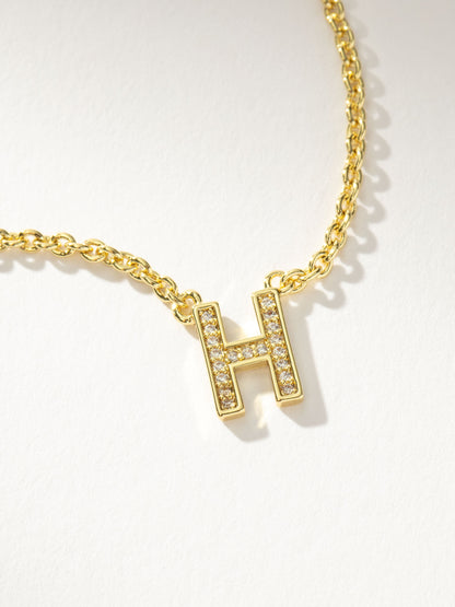 Collar con inicial aquí
