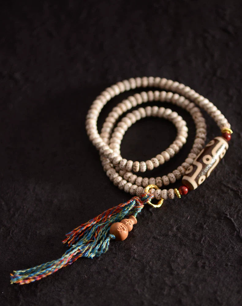 Pulsera Bodhi de Estrella y Luna con Nueve Cuentas Dzi de Hilo Manual
