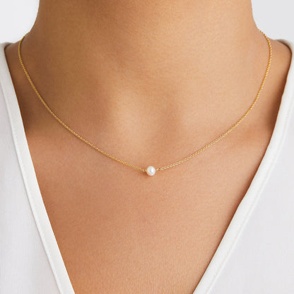 Conjunto de regalo de gargantilla y pulsera con una perla dorada