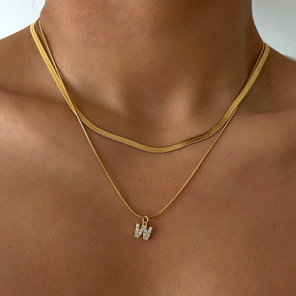 Collar con inicial de espiga