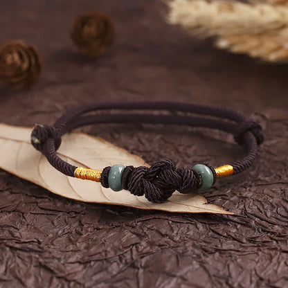 Pulsera trenzada con nudo de la fortuna y jade rojo de Buda