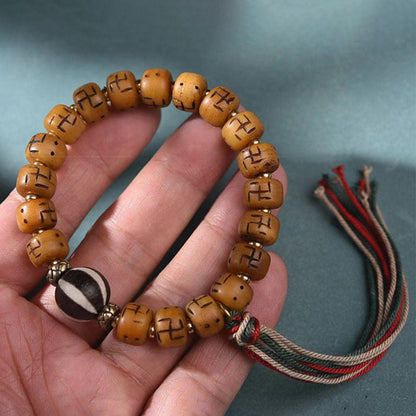 Buddha-Steine, natürliches tibetisches Kamelknochen-Hakenkreuz-Dzi-Perlen-Shankha-Buddha-Charm, Kirtimukha-Glücksschutz-Quastenarmband