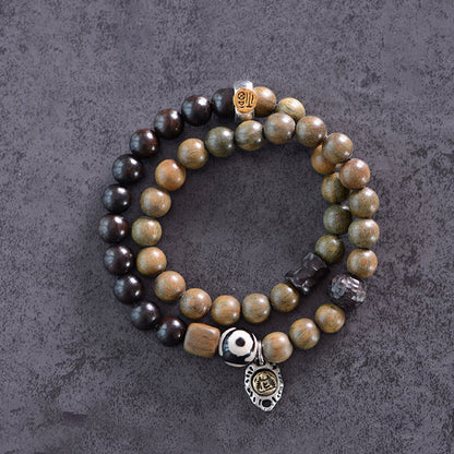 Pulsera de doble vuelta con cuentas Dzi de tres ojos de madera de ébano y sándalo verde tibetano con piedras de Buda y carácter Fu, equilibrio y paz.