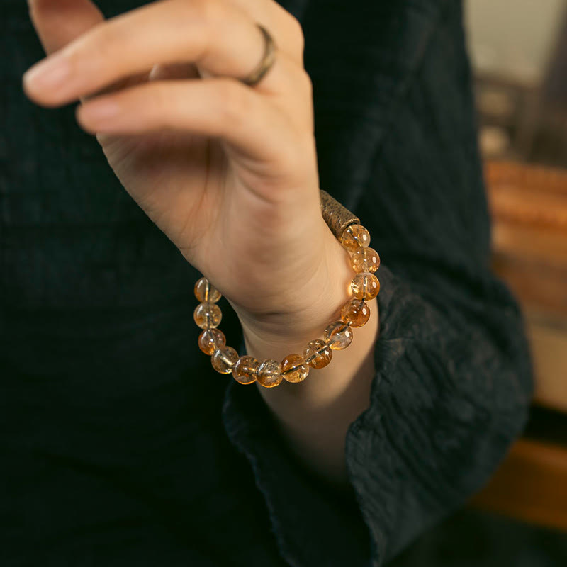 Pulsera protectora de cuentas de latón con cristales de citrino natural de Buddha Stones 