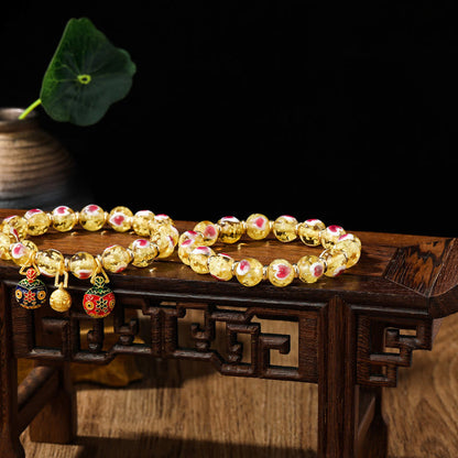 Pulsera de cuentas de vidrio fluorescentes Liuli con corazón de amor rosa y piedras de Buda doradas.