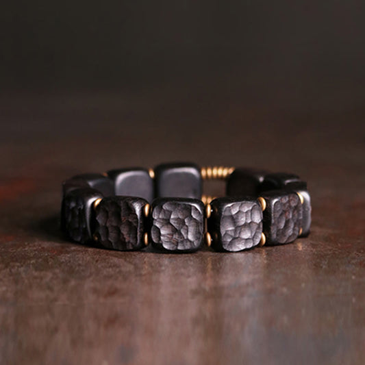 Pulsera de equilibrio de paz de cobre con textura de madera de ébano retro con piedras de Buda 