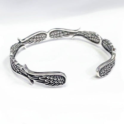 Brazalete de la suerte tallado con alas de ángel y plumas de Buda 