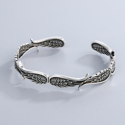 Brazalete de la suerte tallado con alas de ángel y plumas de Buda 