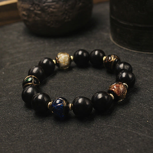 Pulsera de la riqueza con cuentas de vidrio de Liuli, ceniza de incienso y jaboncillo occidental de Buddha Stones