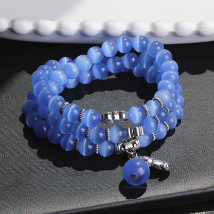 Pulsera triple vuelta con soporte PiXiu de ojo de gato y piedras de Buda
