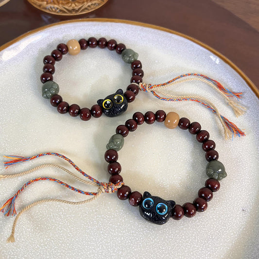 Pulsera de madera con borlas de la paz, con piedras de Buda, madera de ébano y pata de jade de gato encantador 