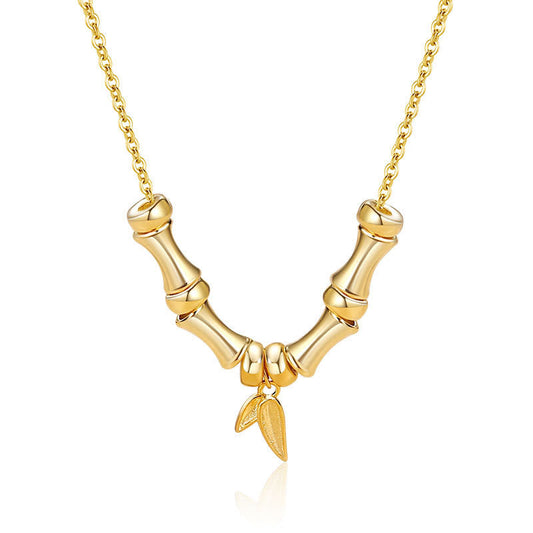 Colgante de collar de acero de titanio con diseño de bambú dorado y piedras de Buda