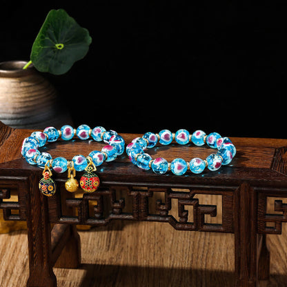 Pulsera de cuentas de vidrio fluorescentes Liuli con corazón de amor rosa y piedras de Buda doradas.