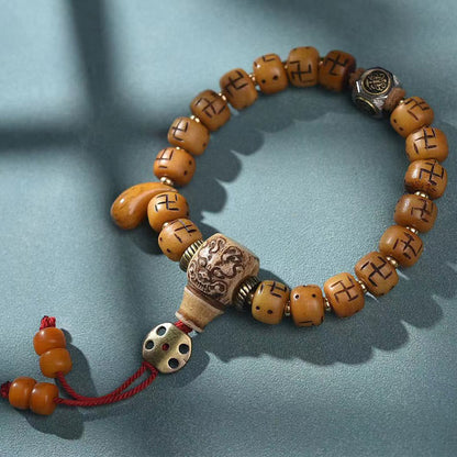 Buddha-Steine, natürliches tibetisches Kamelknochen-Hakenkreuz-Dzi-Perlen-Shankha-Buddha-Charm, Kirtimukha-Glücksschutz-Quastenarmband