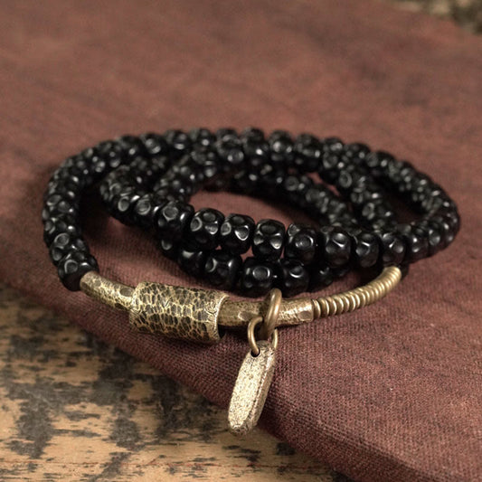 Pulsera de triple vuelta de cobre con cáscara de coco retro de Buddha Stones 