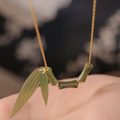 Collar con colgante de riqueza con diseño de hojas de bambú y jade y piedras de Buda