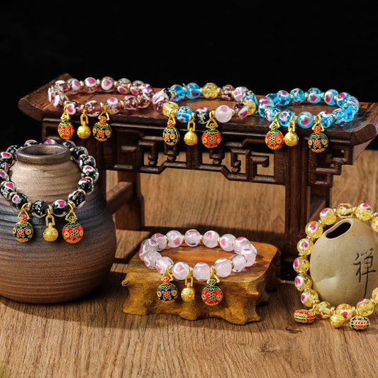 Pulsera de cuentas de vidrio fluorescentes Liuli con corazón de amor rosa y piedras de Buda doradas.