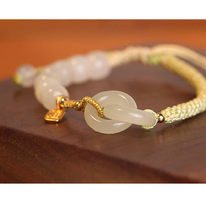 Pulsera trenzada con cuentas de jade hetiano natural de Buda y doble hebilla de paz con carácter Fu 