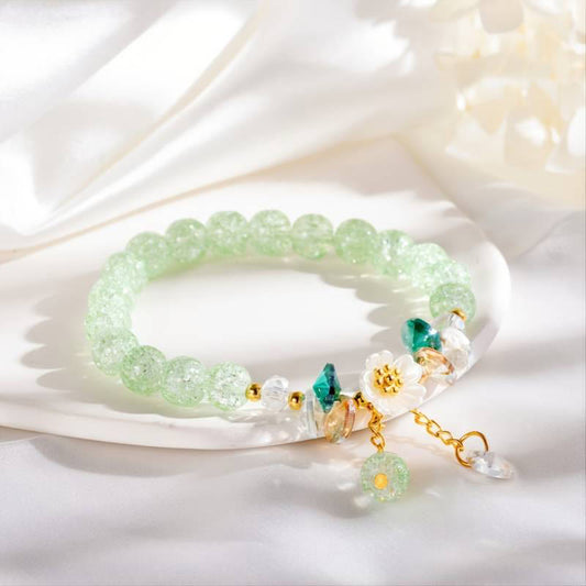 Pulsera de cuentas de vidrio con diseño simple de piedras de Buda y dijes de flores