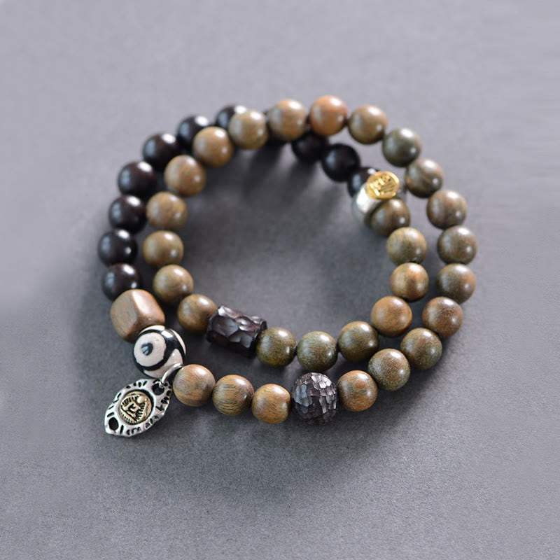 Pulsera de doble vuelta con cuentas Dzi de tres ojos de madera de ébano y sándalo verde tibetano con piedras de Buda y carácter Fu, equilibrio y paz.