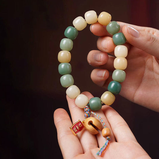 Pulsera con dije de tambor de pez de madera con semillas de Bodhi y degradado natural de Buda 