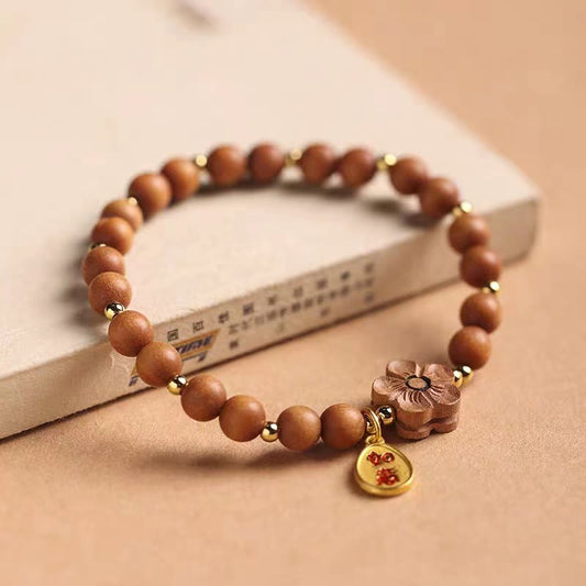 Pulsera de protección con dijes de Ruyi de sándalo rojo, hojas pequeñas y flor de melocotón de sándalo natural y piedras de Buda