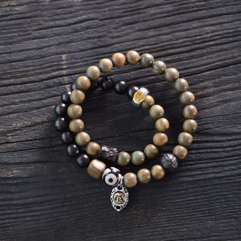 Pulsera de doble vuelta con cuentas Dzi de tres ojos de madera de ébano y sándalo verde tibetano con piedras de Buda y carácter Fu, equilibrio y paz.