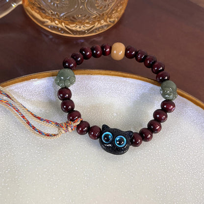 Pulsera de madera con borlas de la paz, con piedras de Buda, madera de ébano y pata de jade de gato encantador 