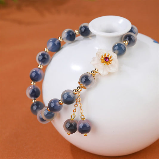 Pulsera de piedras de Buda con ágata azul natural y flor de cerezo para una mayor fuerza curativa