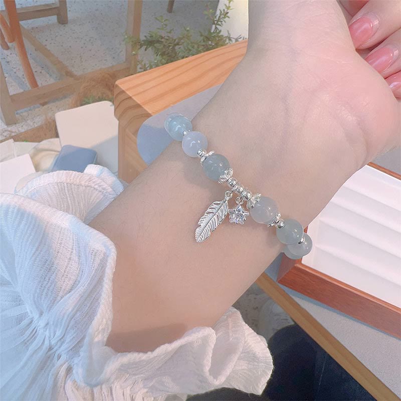 Pulsera con dije de estrella y pluma curativa de ojo de gato y aguamarina en plata de ley 925 con piedras de Buda 