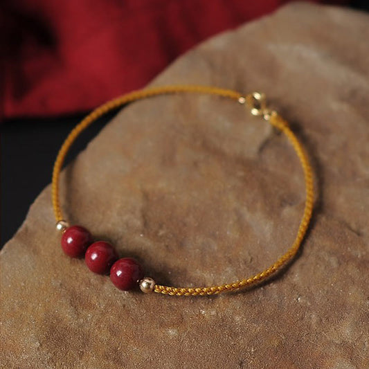 Pulsera trenzada con piedras de Buda bañada en oro de 14 quilates y cinabrio natural con bendición 