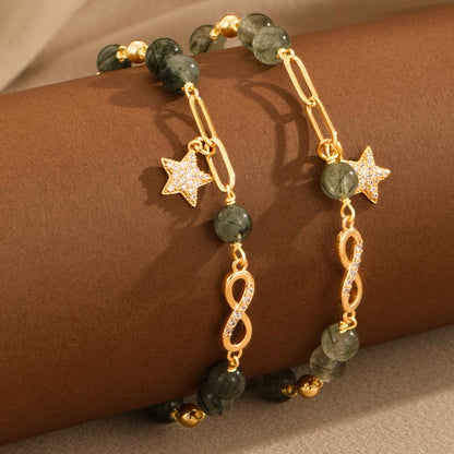 Pulsera de protección de estrellas de amor eterno con lazo de Möbius de cuarzo rutilado verde en oro de 14 quilates de Buddha Stones 