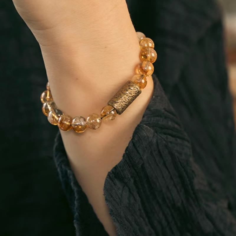 Pulsera protectora de cuentas de latón con cristales de citrino natural de Buddha Stones 