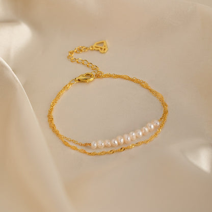 Pulsera trenzada de dos perlas