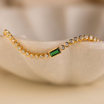 Pulsera de tenis con esmeralda baguette