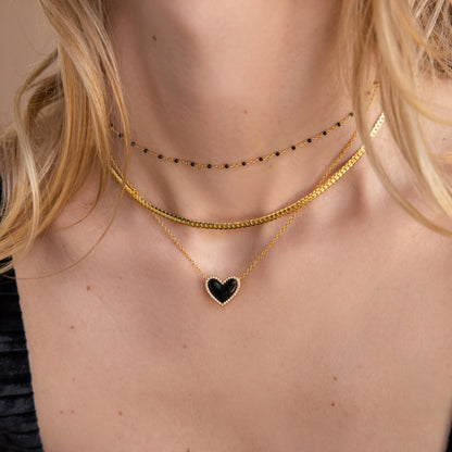 Collar de corazón abullonado con ónix pavé