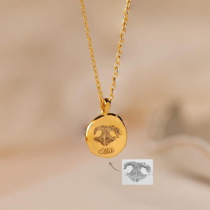 Collar de monedas con huella de pata